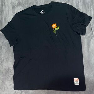 Nike Black Tee with Orange Logo and Green Accent